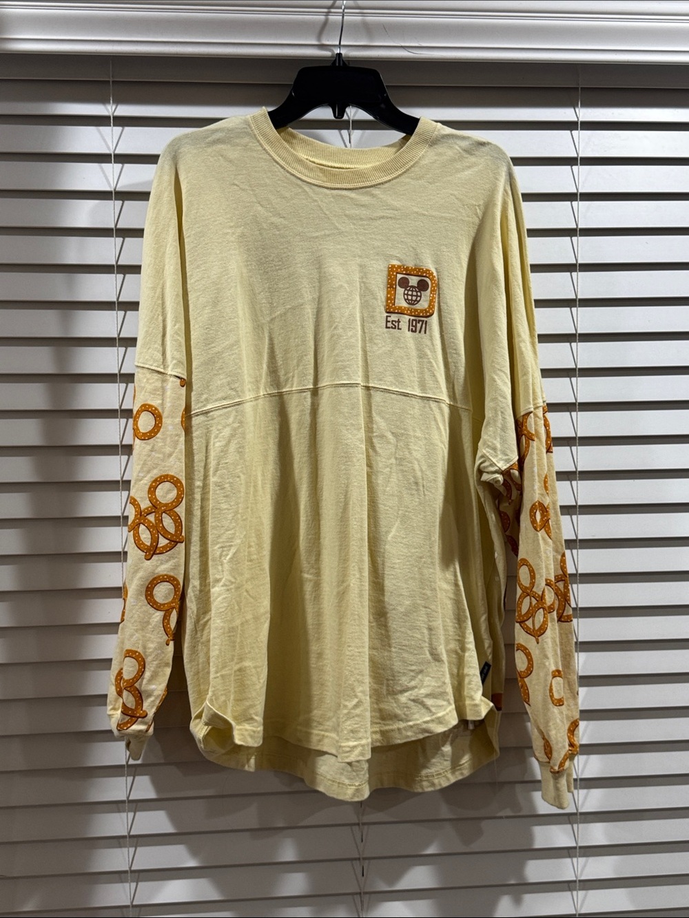Disney Spirit Jersey Long Sleeve Graphic Tee in Pale Yellow with pretzel print